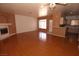 Expansive living room featuring gleaming hardwood floors, a fireplace, and plenty of natural light at 1900 N Torrey Pines Dr # 225, Las Vegas, NV 89108