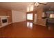 Expansive living room featuring gleaming hardwood floors, a fireplace, and plenty of natural light at 1900 N Torrey Pines Dr # 225, Las Vegas, NV 89108