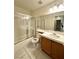 Bright bathroom featuring a shower-over-tub with a sliding glass door and a tiled floor at 1906 Double Delight Ave, North Las Vegas, NV 89032