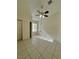 Bedroom with a ceiling fan, tiled floors, and a closet with sliding doors at 1906 Double Delight Ave, North Las Vegas, NV 89032