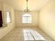Bright dining room with tiled floors and a large window, perfect for Gathering gatherings at 1906 Double Delight Ave, North Las Vegas, NV 89032