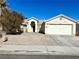 Charming single-story home with a well-maintained xeriscaped front yard and two-car garage at 1906 Double Delight Ave, North Las Vegas, NV 89032