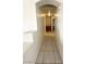 Hallway with tile flooring, archways, and view of built in shelving at 1906 Double Delight Ave, North Las Vegas, NV 89032