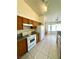 Functional kitchen with tile flooring, granite countertops, and sleek white appliances at 1906 Double Delight Ave, North Las Vegas, NV 89032