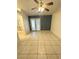 Spacious living room featuring tiled floors and french doors for natural light at 1906 Double Delight Ave, North Las Vegas, NV 89032