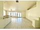 Open-concept living area featuring tile flooring, French doors and a granite-topped breakfast bar at 1906 Double Delight Ave, North Las Vegas, NV 89032