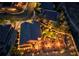 Aerial night view of property showing the backyard putting green, landscaping, and outdoor seating areas at 2064 Poetry Ave, Henderson, NV 89052