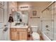Cozy bathroom featuring a single sink vanity, toilet, shower over tub, and neutral wall color at 2064 Poetry Ave, Henderson, NV 89052