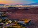 An elevated view captures the city skyline against a mountain backdrop, highlighting the community's proximity to the city at 2064 Poetry Ave, Henderson, NV 89052