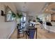 Dining room features stylish table set, hardwood flooring and bar access to kitchen at 2064 Poetry Ave, Henderson, NV 89052