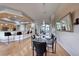 Dining room features stylish table set, hardwood flooring and bar access to kitchen at 2064 Poetry Ave, Henderson, NV 89052