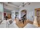 Open-concept space with a grand piano, comfortable seating, and access to other living areas at 2064 Poetry Ave, Henderson, NV 89052