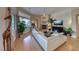 Living room features hardwood flooring, modern fireplace, open floor plan, and neutral color palette at 2064 Poetry Ave, Henderson, NV 89052