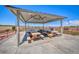 A covered picnic area with multiple tables offers a comfortable spot for outdoor gatherings and dining within the community at 2064 Poetry Ave, Henderson, NV 89052