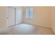 Cozy bedroom featuring neutral carpet, light walls, closet, and a bright window at 225 Deer Crossing Way, Henderson, NV 89012