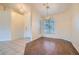 Dining area with hardwood flooring, chandelier, and natural light through window at 225 Deer Crossing Way, Henderson, NV 89012
