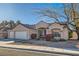 Charming single-story home featuring a three-car garage and well-maintained desert landscaping at 225 Deer Crossing Way, Henderson, NV 89012