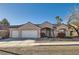 Charming single-story home featuring a three-car garage and well-maintained desert landscaping at 225 Deer Crossing Way, Henderson, NV 89012