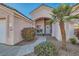 Inviting front entrance with a charming desert landscape and a cozy courtyard at 225 Deer Crossing Way, Henderson, NV 89012