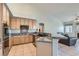 Well-appointed kitchen with granite countertops, stainless steel appliances, and breakfast bar at 225 Deer Crossing Way, Henderson, NV 89012