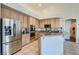 Bright kitchen featuring stainless steel appliances, ample cabinet space, and granite countertops at 225 Deer Crossing Way, Henderson, NV 89012