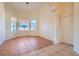 Bright living room with tile flooring, high ceilings, large windows, and a decorative column at 225 Deer Crossing Way, Henderson, NV 89012