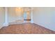 Open-concept living area with tile flooring, decorative columns, and an elegant chandelier at 225 Deer Crossing Way, Henderson, NV 89012