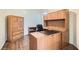Home office featuring a large built-in desk, shelving, and hardwood floors at 225 Deer Crossing Way, Henderson, NV 89012