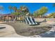 Community playground featuring modern equipment, a covered picnic area, and rubber flooring at 225 Deer Crossing Way, Henderson, NV 89012