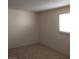 Bedroom with neutral carpet and a window allowing natural light at 2290 Desert Inn, Las Vegas, NV 89169