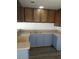 Kitchen with granite counters and wood cabinets at 2290 Desert Inn, Las Vegas, NV 89169