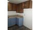 Kitchen with granite counters and wood cabinets at 2290 Desert Inn, Las Vegas, NV 89169