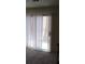 View of living room with sliding doors, carpet, and stairs at 2290 Desert Inn, Las Vegas, NV 89169