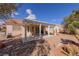 Charming backyard featuring a covered patio and low-maintenance desert landscaping at 2456 Desert Sands Dr, Las Vegas, NV 89134