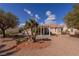 Desert landscaped backyard with a covered patio, ideal for enjoying the outdoor scenery at 2456 Desert Sands Dr, Las Vegas, NV 89134