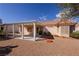 Backyard with a covered patio, desert landscaping, and a calming outdoor space at 2456 Desert Sands Dr, Las Vegas, NV 89134