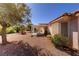Inviting backyard featuring a covered patio and well-maintained desert landscape at 2456 Desert Sands Dr, Las Vegas, NV 89134