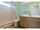 Bathroom with a white sliding glass door shower, neutral vanity and green walls at 2456 Desert Sands Dr, Las Vegas, NV 89134