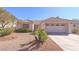 Inviting single-story home with a well-manicured front yard and desert landscaping at 2456 Desert Sands Dr, Las Vegas, NV 89134