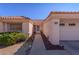 Inviting front entrance with a tiled roof, landscaped walkway, and desert accents at 2456 Desert Sands Dr, Las Vegas, NV 89134