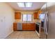 Well-lit kitchen with stainless steel appliances, tile backsplash, and a window over the sink at 2456 Desert Sands Dr, Las Vegas, NV 89134