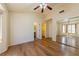 Spacious main bedroom with hardwood floors, ceiling fan, closet and ensuite bathroom at 2456 Desert Sands Dr, Las Vegas, NV 89134