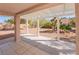 Covered patio offers a relaxing space with views of the desert-style backyard landscape at 2456 Desert Sands Dr, Las Vegas, NV 89134