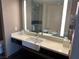 Contemporary bathroom vanity with a vessel sink, illuminated mirror, and a bathtub at 2600 W Harmon Ave # 25019, Las Vegas, NV 89158