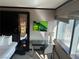 Bedroom workspace with a desk, chair, and a beautiful city view from the window at 2600 W Harmon Ave # 25019, Las Vegas, NV 89158