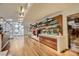 The retail boutique features a display of curated products with wood floors and large windows at 2600 W Harmon Ave # 25019, Las Vegas, NV 89158