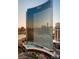 The contemporary high-rise building has reflective glass windows, sleek design, and a pool deck at 2600 W Harmon Ave # 25019, Las Vegas, NV 89158