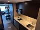 Modern kitchenette featuring a microwave, cooktop, sink, and views to the main suite at 2600 W Harmon Ave # 25019, Las Vegas, NV 89158