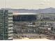 A view of the Allegiant Stadium and surrounding cityscape, with mountains in the background at 2600 W Harmon Ave # 25019, Las Vegas, NV 89158