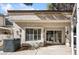 Enclosed back patio area features a small garden, window, and sliding glass doors at 2632 Starfish Ct, Las Vegas, NV 89128